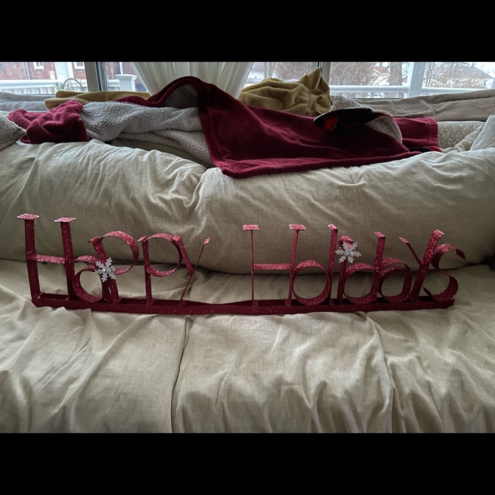 Happy holiday sign sets on the table